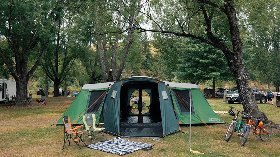 Takahe 10 Blackout Family Tent Pitched under a tree canopy in Quinney's Bush, South Island.